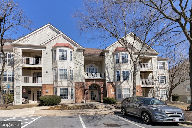 view of property featuring uncovered parking