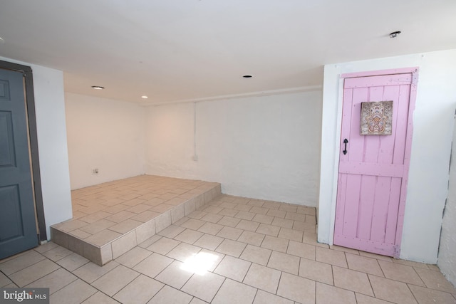 unfurnished room with light tile patterned floors