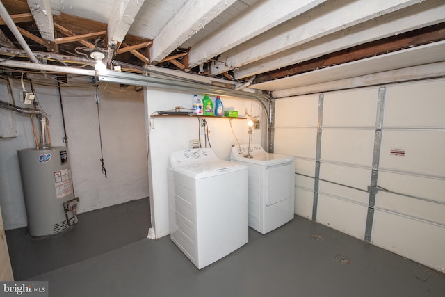 interior space with gas water heater, independent washer and dryer, and laundry area