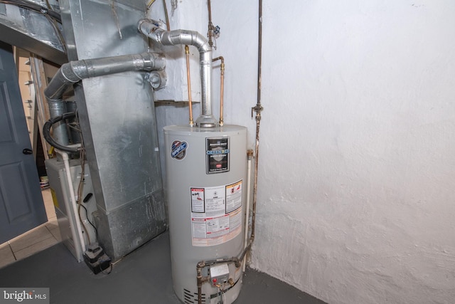 utility room featuring gas water heater and heating unit