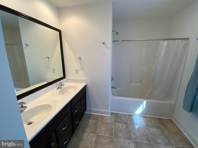 full bathroom featuring a sink, shower / bathtub combination with curtain, double vanity, and tile patterned floors