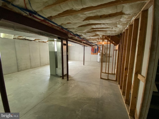 unfinished basement with water heater