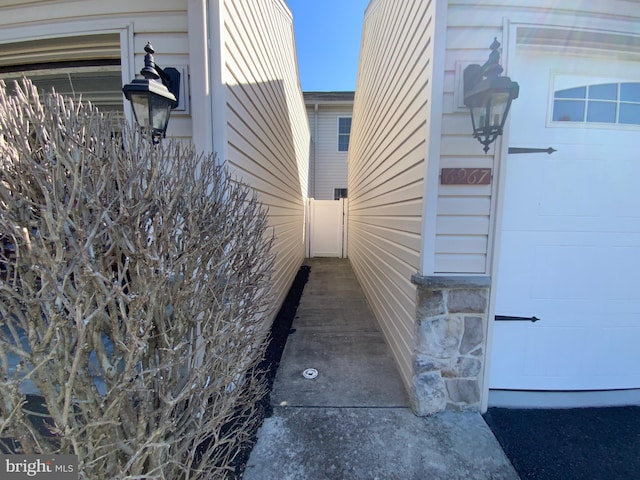 view of property exterior featuring a garage