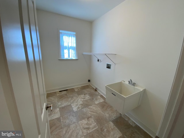 washroom with washer hookup, laundry area, and baseboards