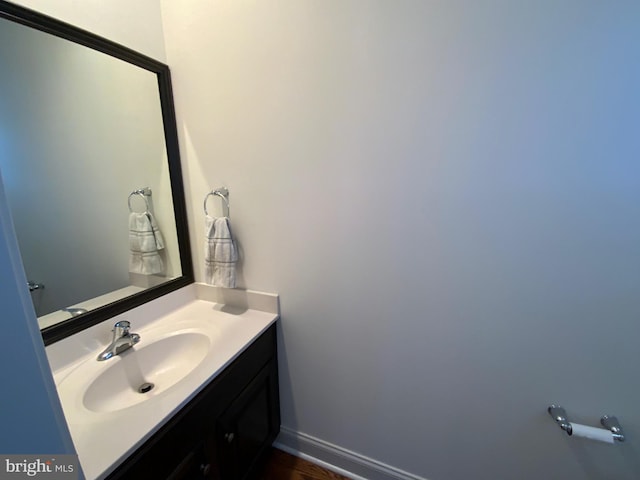 bathroom featuring baseboards and vanity