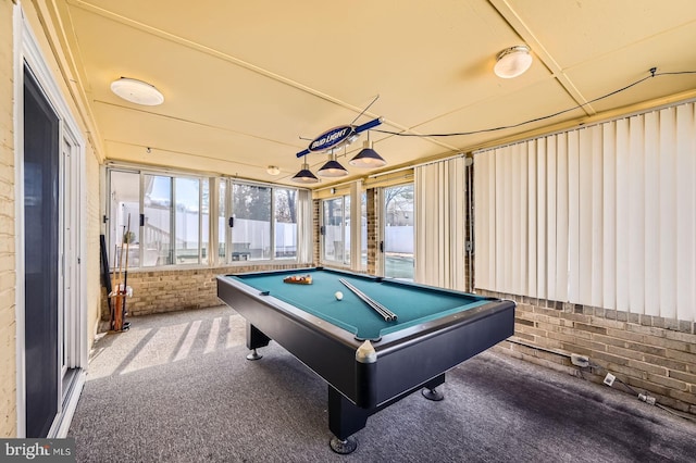 recreation room with brick wall, billiards, and carpet