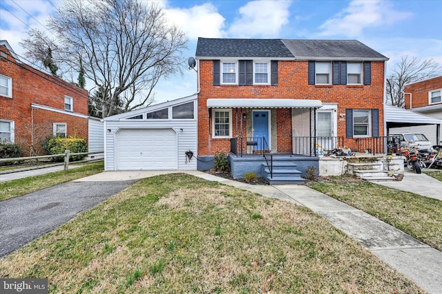 view of front facade with brick siding, a shingled roof, a front lawn, aphalt driveway, and an attached garage