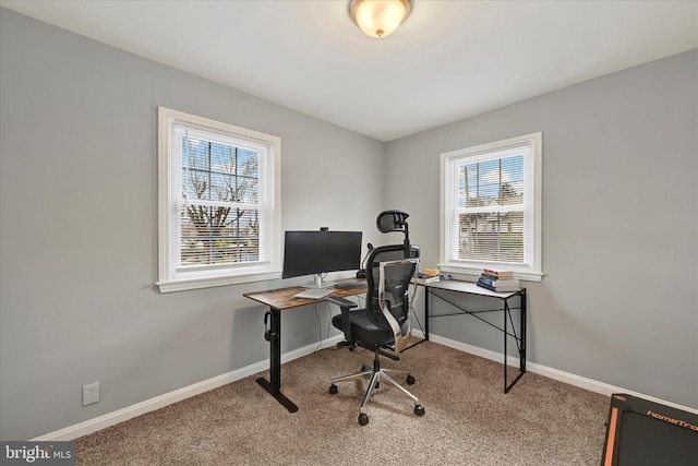 carpeted office with baseboards