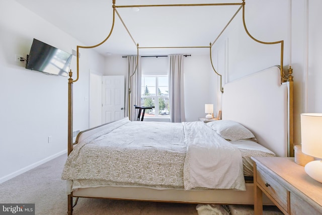 bedroom with carpet flooring and baseboards