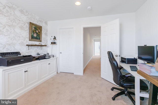 office area featuring wallpapered walls, an accent wall, baseboards, light colored carpet, and recessed lighting