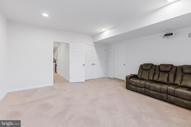 living area with carpet flooring, recessed lighting, and baseboards