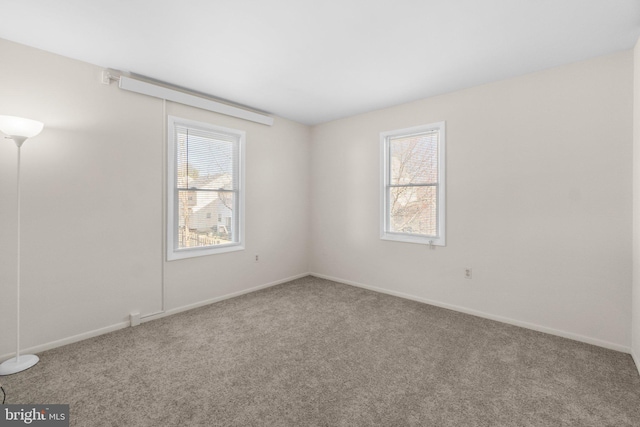 unfurnished room featuring carpet