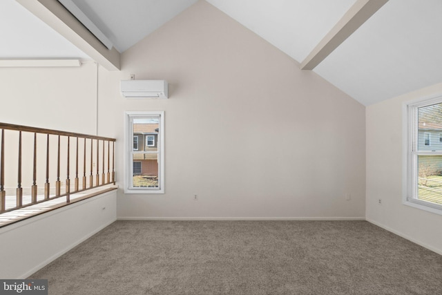 carpeted spare room with baseboards, high vaulted ceiling, and a wall unit AC