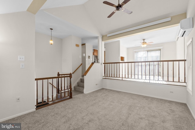 carpeted spare room featuring an AC wall unit, baseboards, and vaulted ceiling