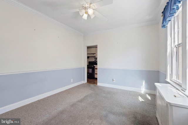 unfurnished room with plenty of natural light, carpet floors, and ornamental molding