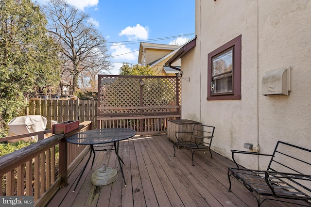 wooden deck with area for grilling