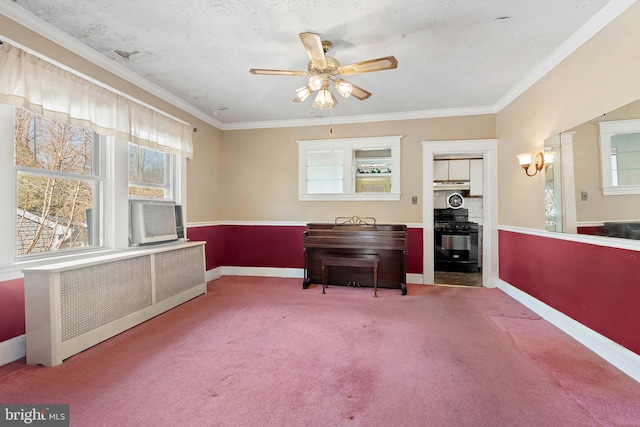 living area featuring ornamental molding, radiator, baseboards, and carpet floors