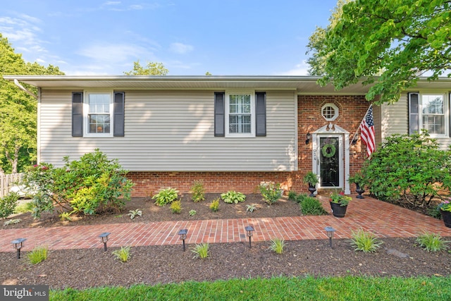 view of front of home with brick siding