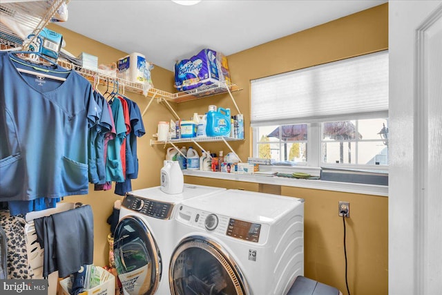 washroom featuring laundry area and washer and clothes dryer