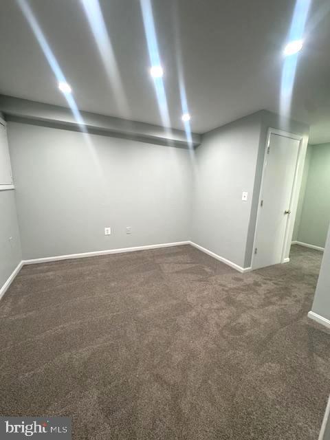 finished basement featuring carpet and baseboards