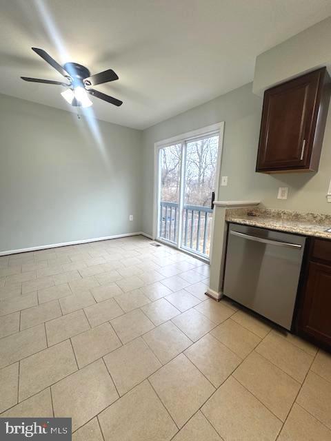 kitchen featuring light tile patterned floors, stainless steel dishwasher, ceiling fan, dark brown cabinets, and baseboards