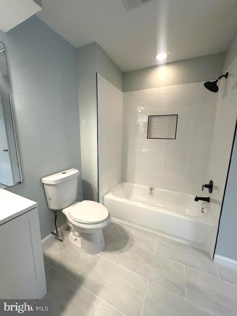 full bath with shower / washtub combination, visible vents, vanity, and toilet