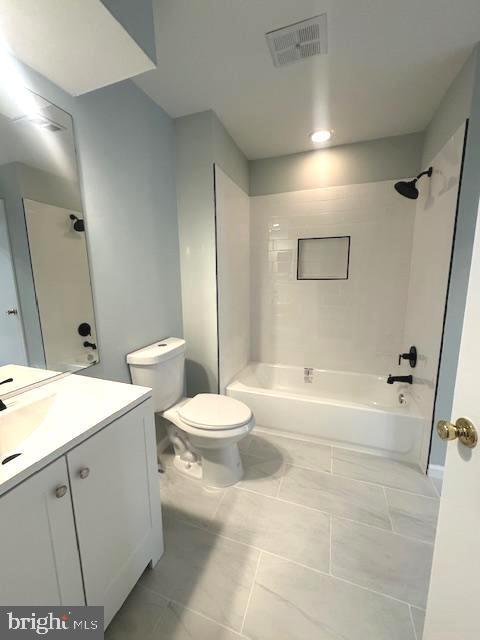 full bath with toilet, washtub / shower combination, visible vents, and vanity