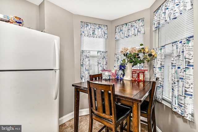 dining area featuring baseboards