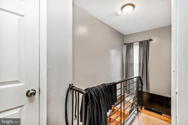 stairway featuring wood finished floors