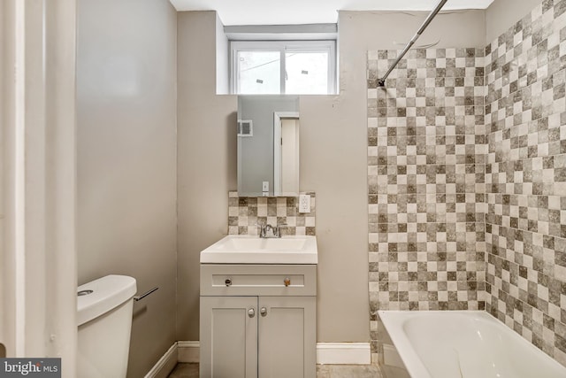 bathroom with bathtub / shower combination, toilet, visible vents, vanity, and tasteful backsplash