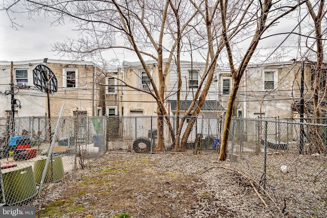 view of yard with a residential view and fence