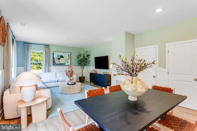 living area featuring wood finished floors, visible vents, and recessed lighting