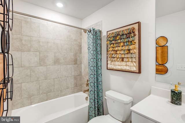 full bathroom featuring shower / bathtub combination with curtain, toilet, and vanity