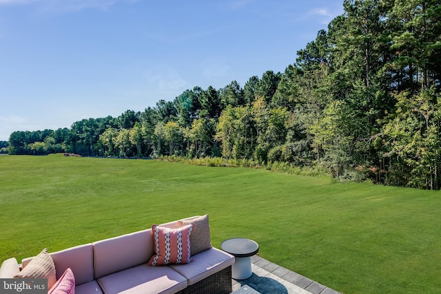 view of yard with a view of trees