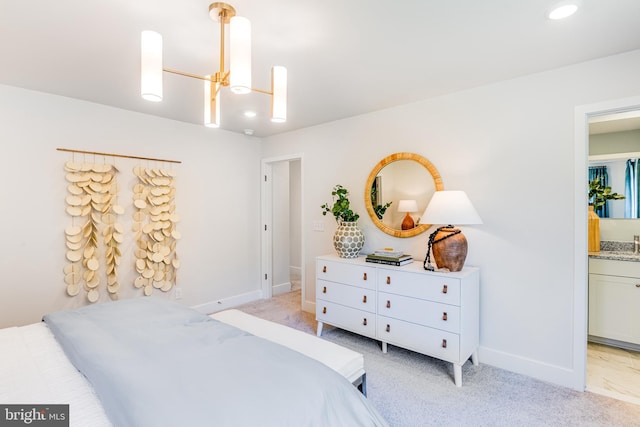 bedroom with light colored carpet and baseboards