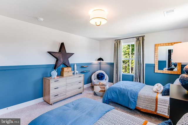 bedroom with carpet flooring, visible vents, and baseboards