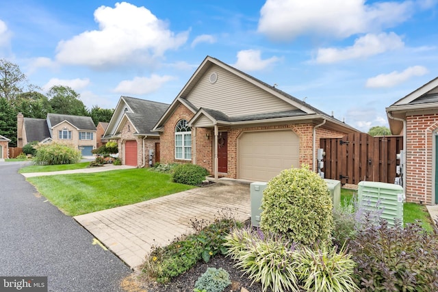 view of front of house with driveway, an attached garage, fence, and brick siding