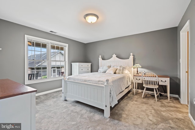 bedroom featuring carpet floors, baseboards, and visible vents