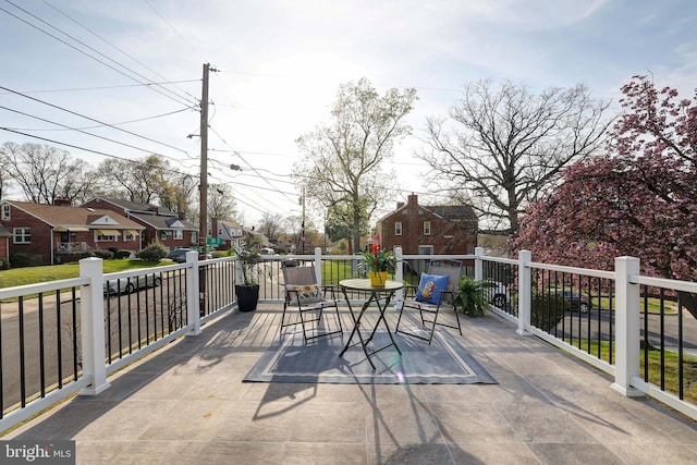 view of patio / terrace featuring a residential view and outdoor dining area