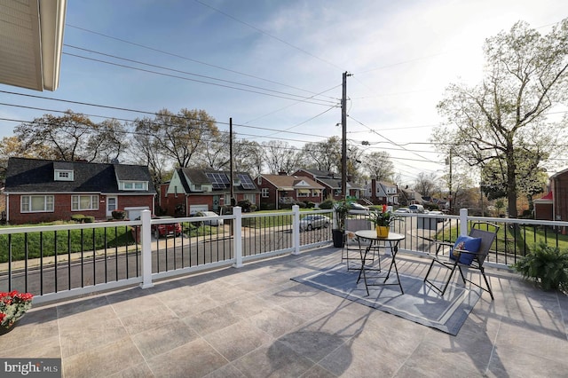 view of patio with a residential view