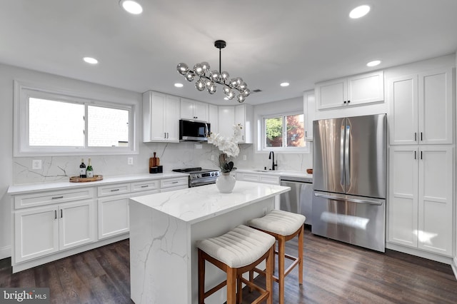 kitchen featuring white cabinetry, appliances with stainless steel finishes, and a sink