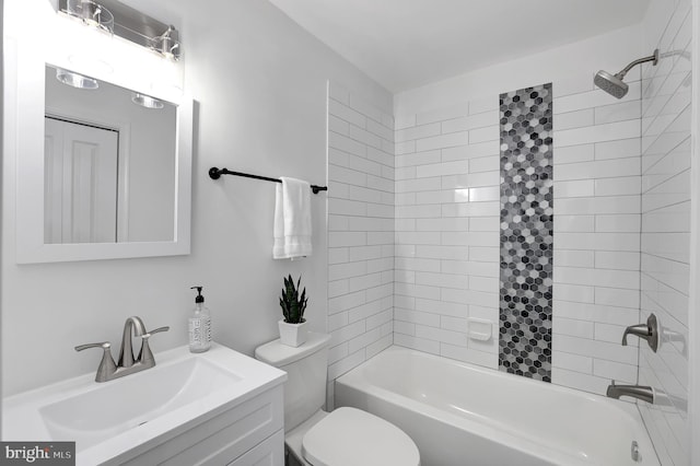 bathroom with  shower combination, vanity, and toilet