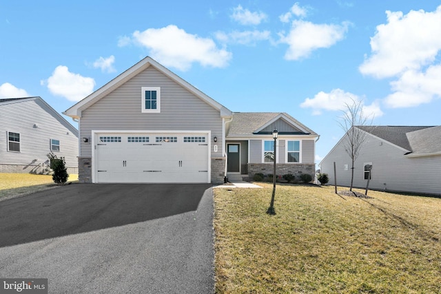 view of front of home with a garage, stone siding, aphalt driveway, and a front yard