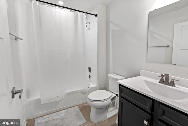 bathroom with vanity, shower / bath combo with shower curtain, and toilet