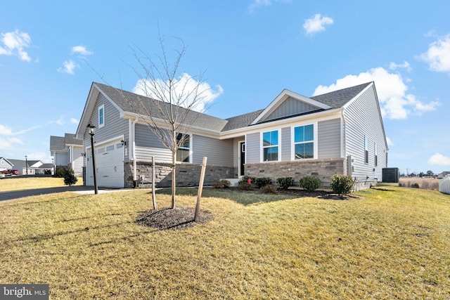 view of front of house featuring an attached garage, board and batten siding, cooling unit, stone siding, and a front lawn