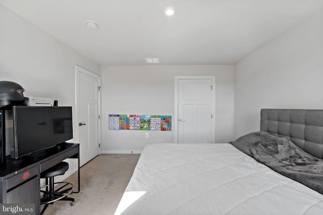 carpeted bedroom with baseboards