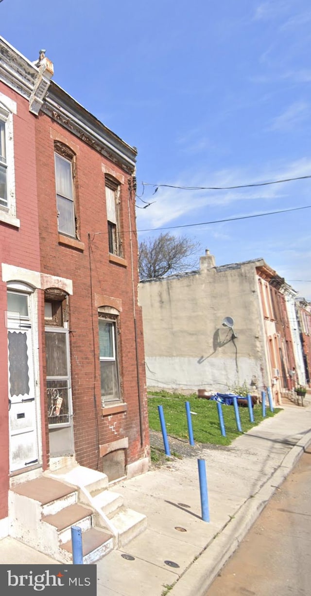 view of home's exterior featuring brick siding