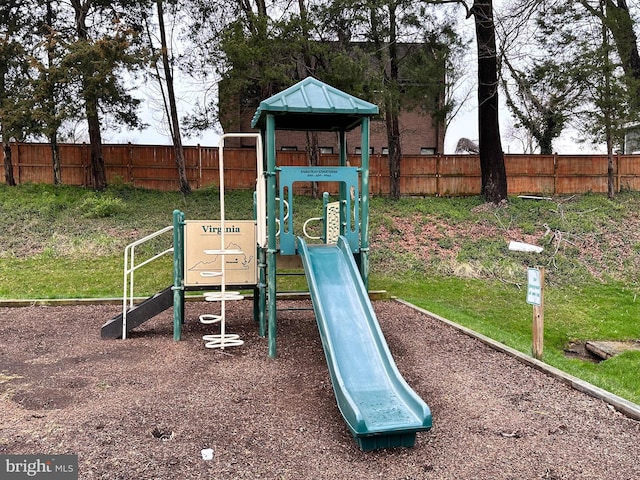 view of playground featuring fence