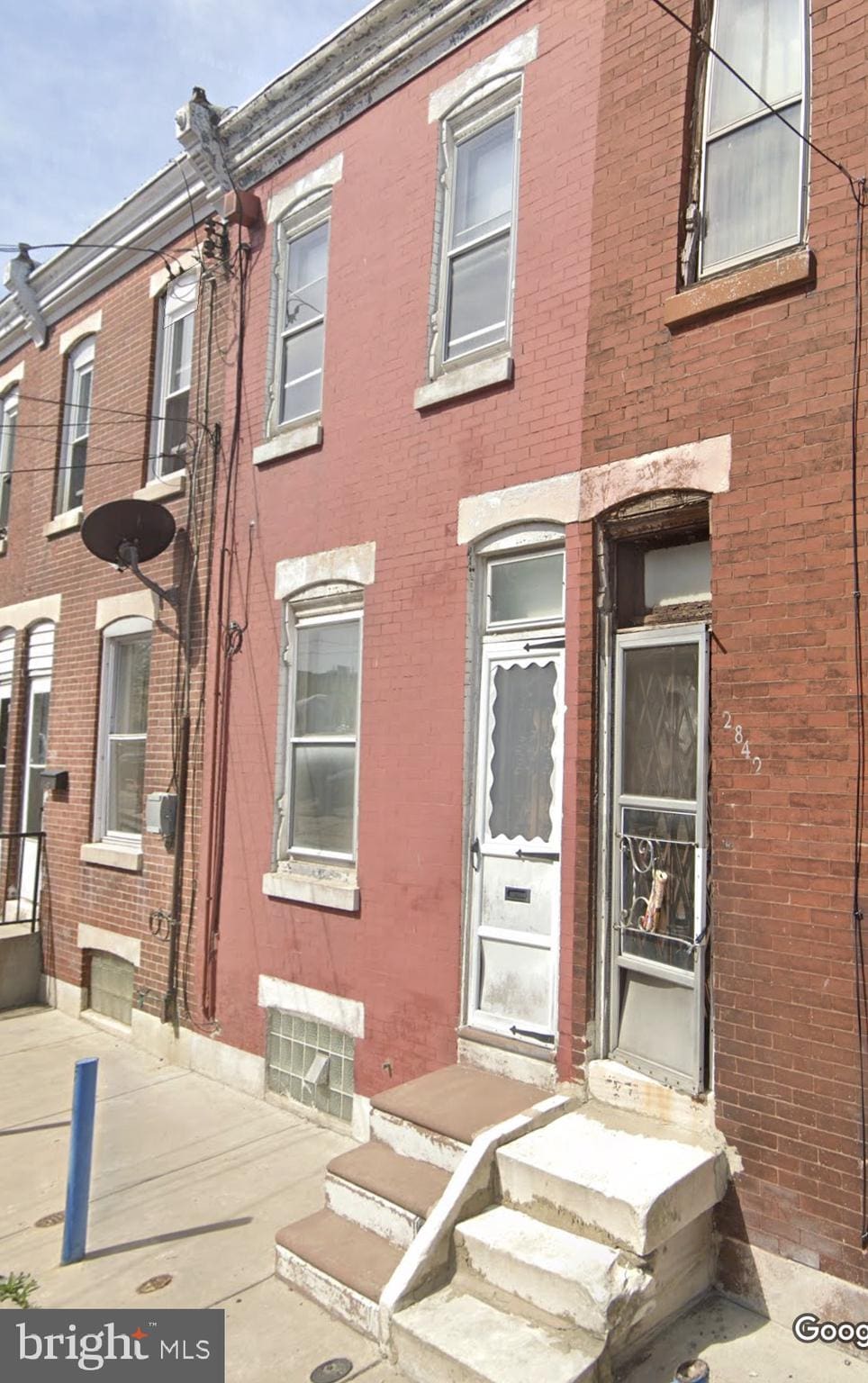 view of property with brick siding