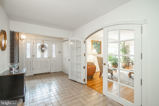 foyer entrance featuring arched walkways